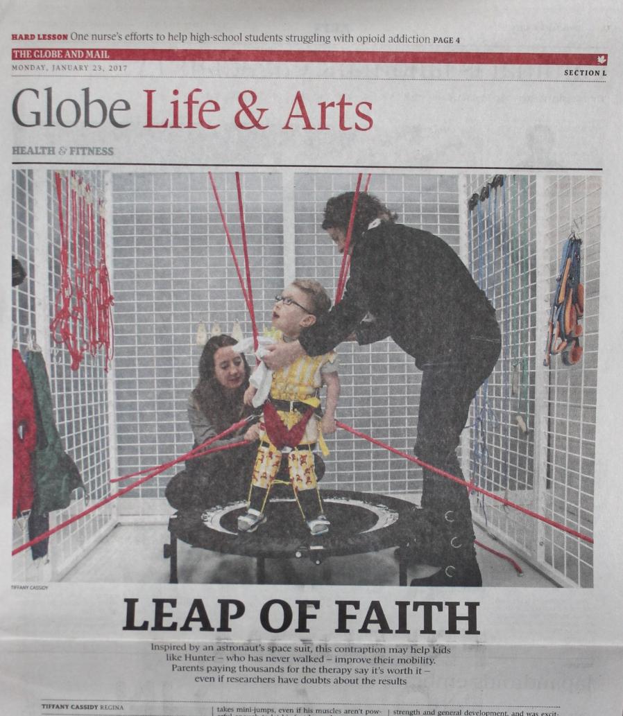 The story image shows a small child on a trampoline while two women help strap him in to a series of bungee chords. The headline says