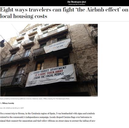 The story image shows an apartment building with a banner hanging over a balcony that reads 