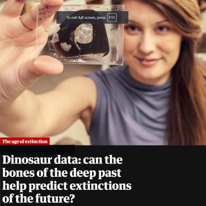 A woman holds up a photo of a fossil. The headline says 
