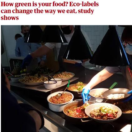 The story image shows cafeteria workers serving food. The headline says 